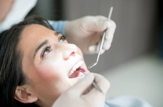 dentist checking teeth bonding